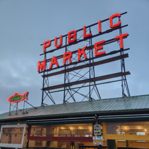 Pike Public Market sign in an early Seattle morning sky