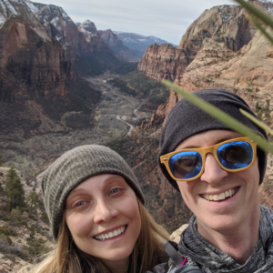 Travel Couple posing with Zion Canyon in the backround